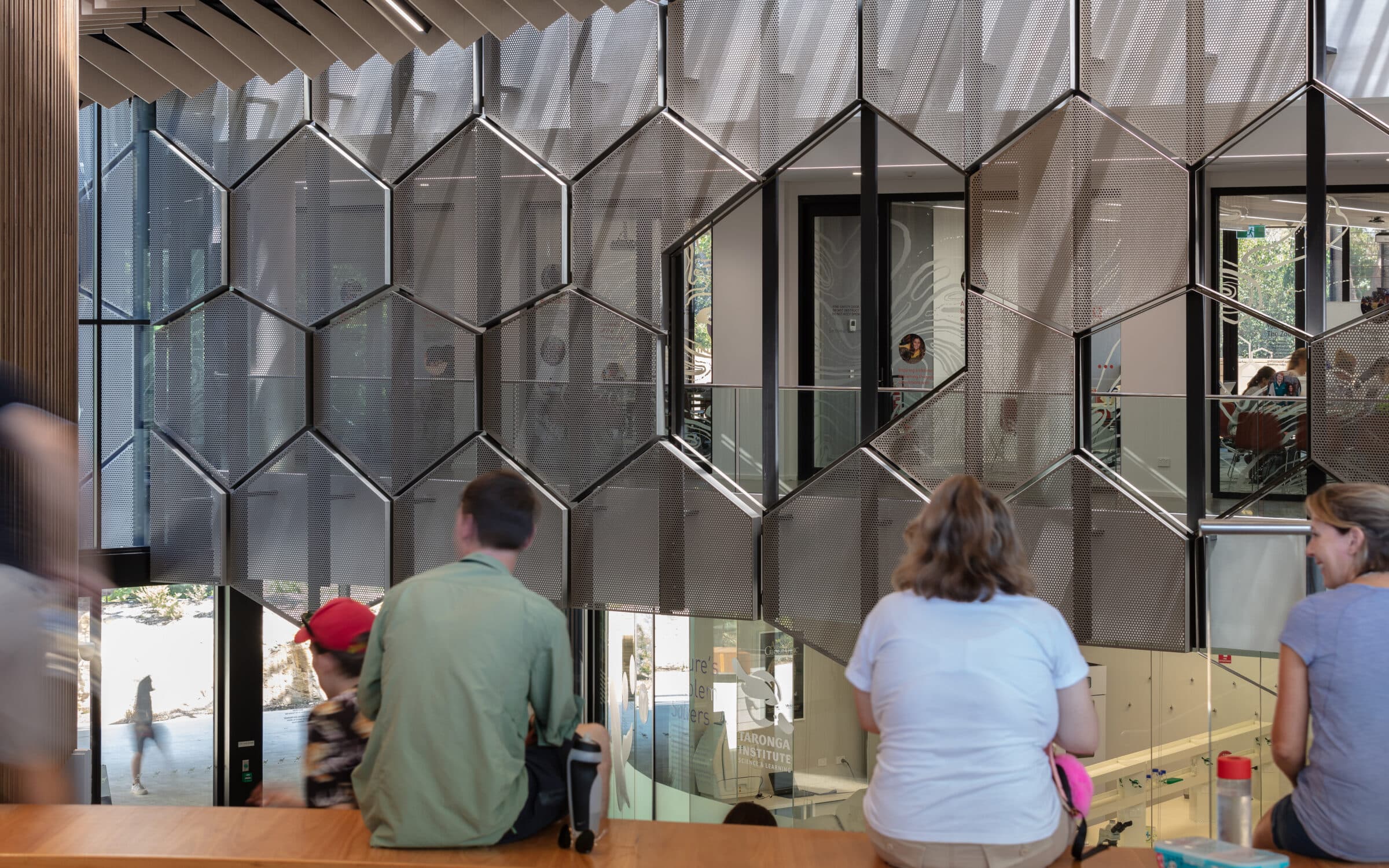 People sitting in the main atrium of the Taronga Institute